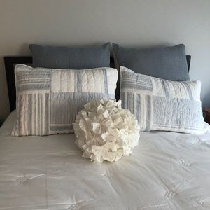White ruffled circular decorative pillow
